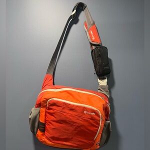 Pacsafe orange messenger bag